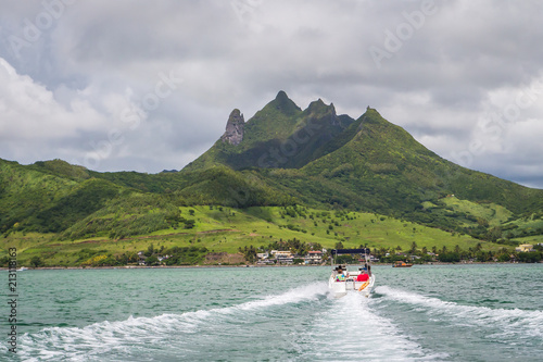 Mauritius - February 15, 2018 - a motor boat rides towards the island