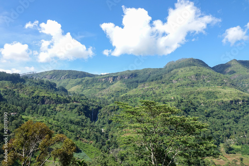Mountain landscape in a green valley. View of Puna Waterfall in Central Province, Sri Lanka