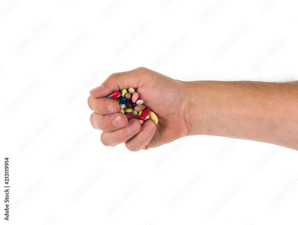 hand with medicinal pills on a white background hand with medicinal pills on a white background