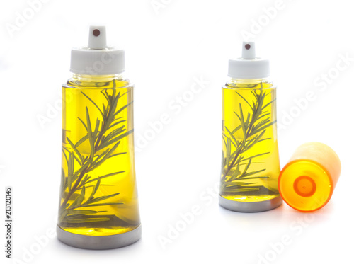 Olive Oil in Bottle with Leaves isolated on white