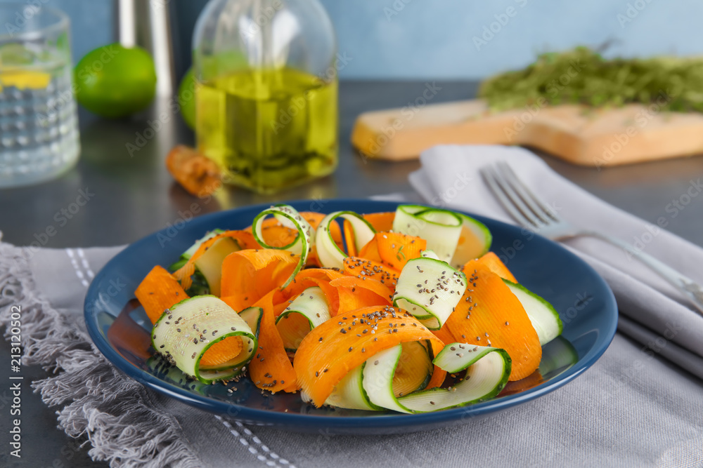 Plate with tasty carrot salad on table Plate with tasty carrot salad on table