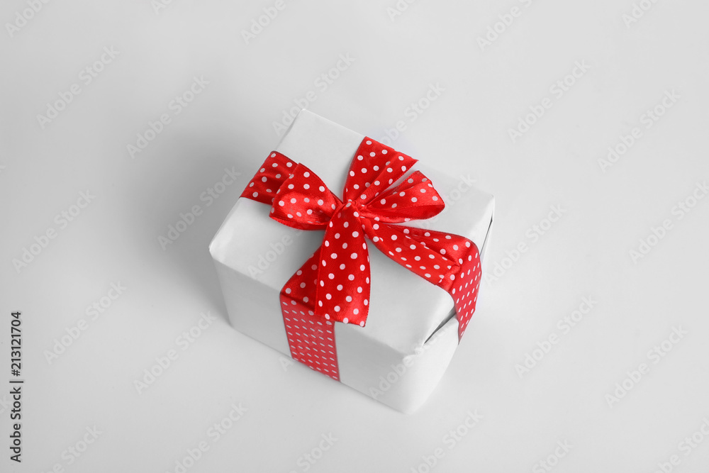 Beautifully wrapped gift box on white background Beautifully wrapped gift box on white background