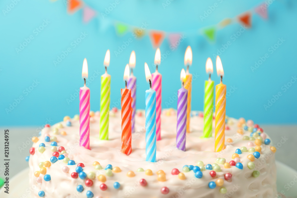 Delicious birthday cake with burning candles, closeup StockFoto