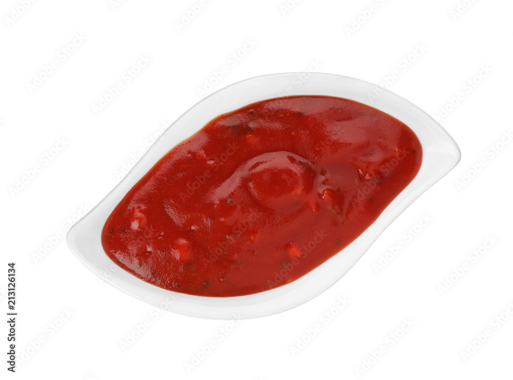 Gravy boat with spicy chili sauce on white background, top view Gravy boat with spicy chili sauce on white background, top view