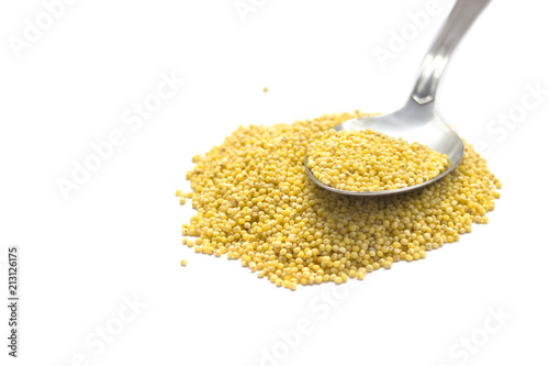 Cereals isolated on white : Millet with spoon