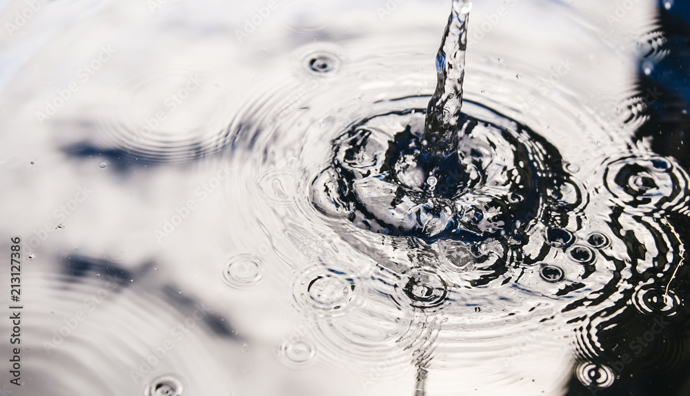 Rainwater harvesting in a large polymer tank on the terrace of a house. Ripples on the surface of water. Aquaphobia - fear of water.