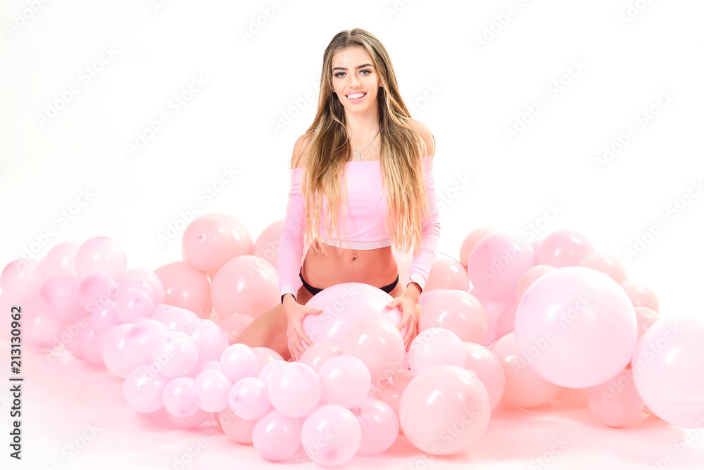 Happy smiling woman with long hair and colorful balloon celebrate party. Preparation to birthday party. Cute smiling girl laying in colorful balloons. Celebration concept. Party mood. Happy smiling woman with long hair and colorful balloon celebrate party. Preparation to birthday party. Cute smiling girl laying in colorful balloons. Celebration concept. Party mood.