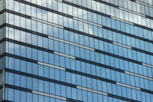 Skyscraper wall of glass in the daytime