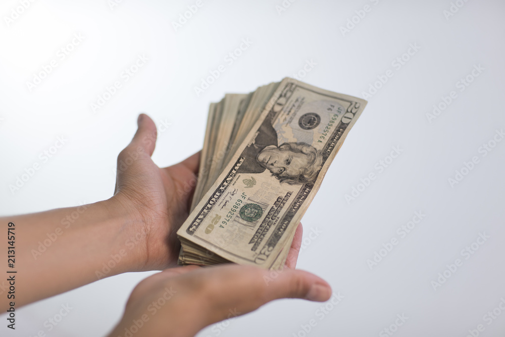 two people making money transaction, dollars, euros two people making money transaction, dollars, euros