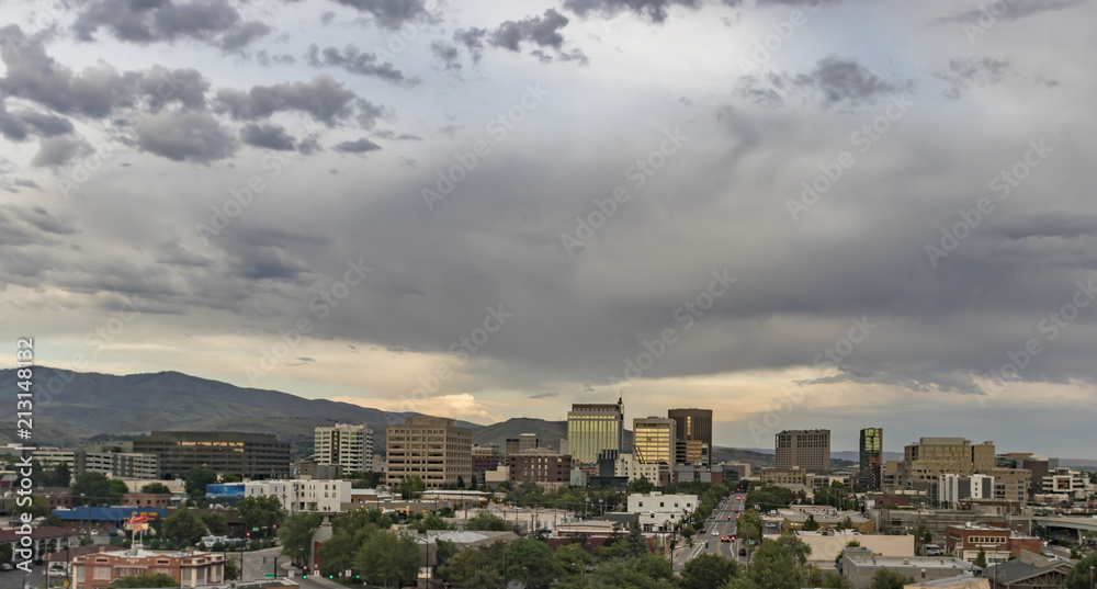 Boise, Idaho. Cityscape with a view from the west at sunset in summertime. Downtown streets and skyscrapers and the Boise Foothills.