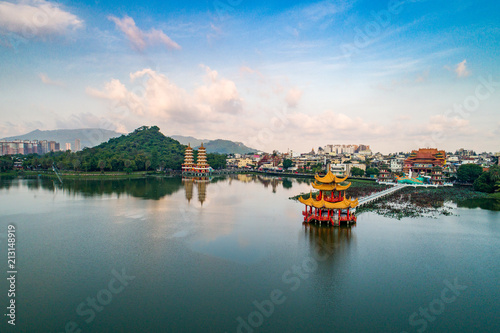 Pagodas at the lake in front of the temples and mountain