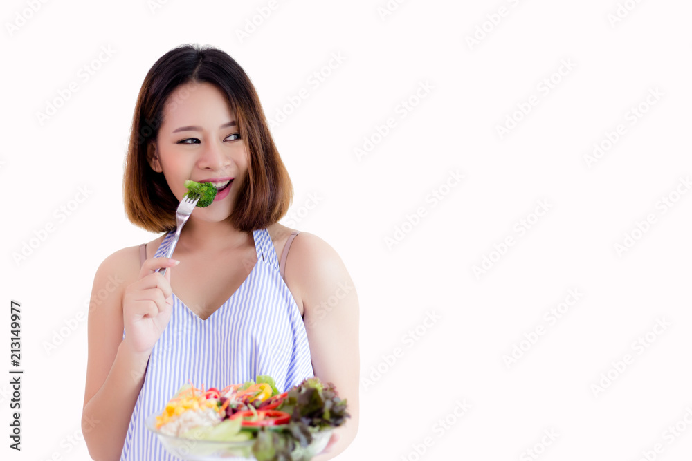 Healthy concept: Charming beautiful woman hold fork and eat vegetable or broccoli. It good for health, lose weight or diet. Attractive girl feel happy when she eat it, isolated background, copy space Healthy concept: Charming beautiful woman hold fork and eat vegetable or broccoli. It good for health, lose weight or diet. Attractive girl feel happy when she eat it, isolated background, copy space