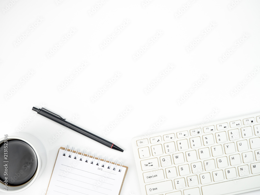 Modern white office desk table with keyboard computer, coffee and other office supplies of necessity, Top view with copy space Modern white office desk table with keyboard computer, coffee and other office supplies of necessity, Top view with copy space