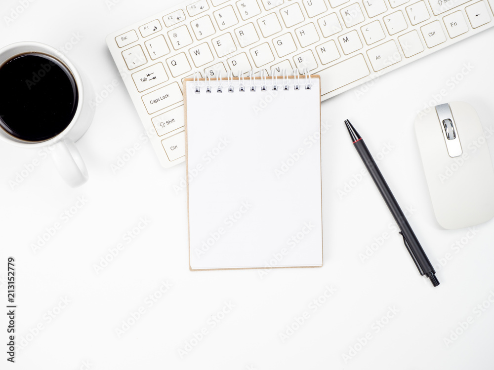 Modern white office desk table with keyboard computer, coffee and other office supplies of necessity, Top view with copy space Modern white office desk table with keyboard computer, coffee and other office supplies of necessity, Top view with copy space