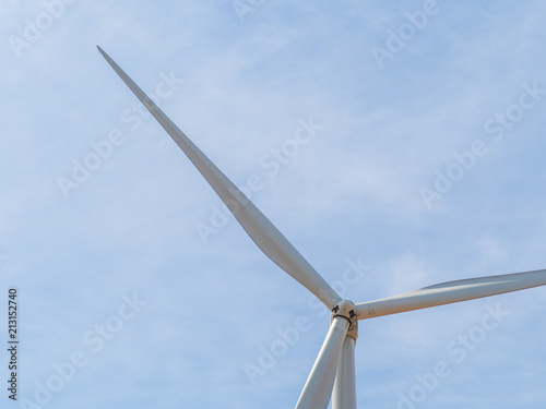 Landscape Wind turbines generating electricity with blue sky and mountain
