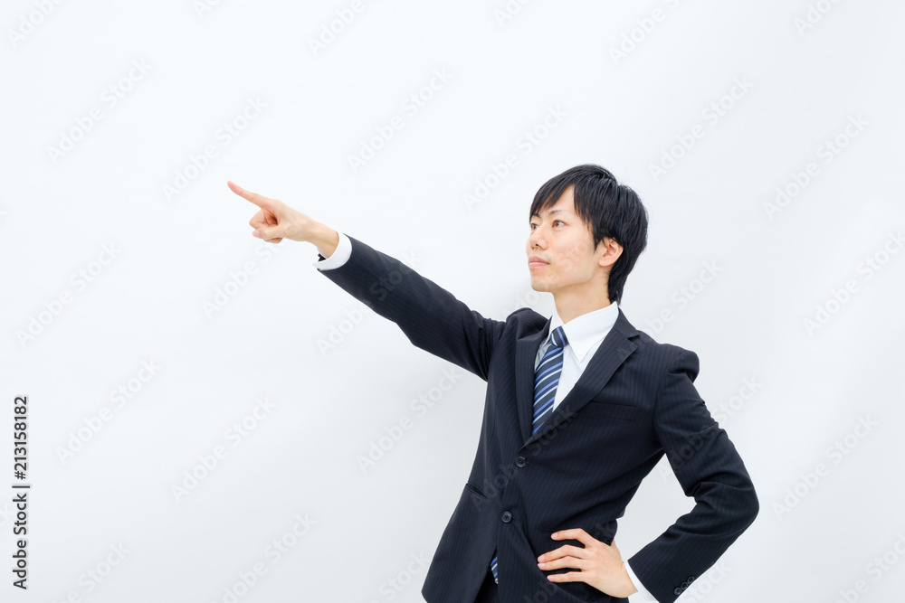 何かを指さすビジネスマン 何かを指さすビジネスマン