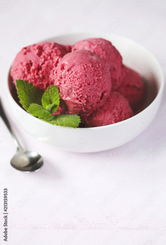 Raspberry ice cream in white bowl Raspberry ice cream in white bowl