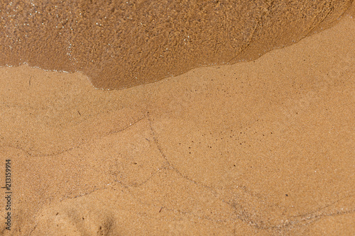 Fototapeta Naklejka Na Ścianę i Meble -  Overhead shot of sand with waves lines
