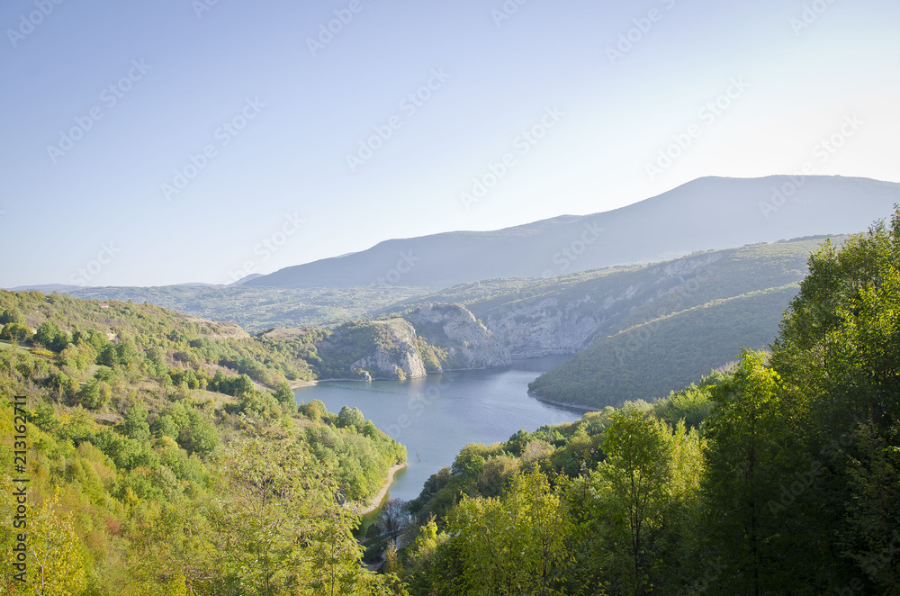 The open valley and soft calm river in the Croatian mountain sides