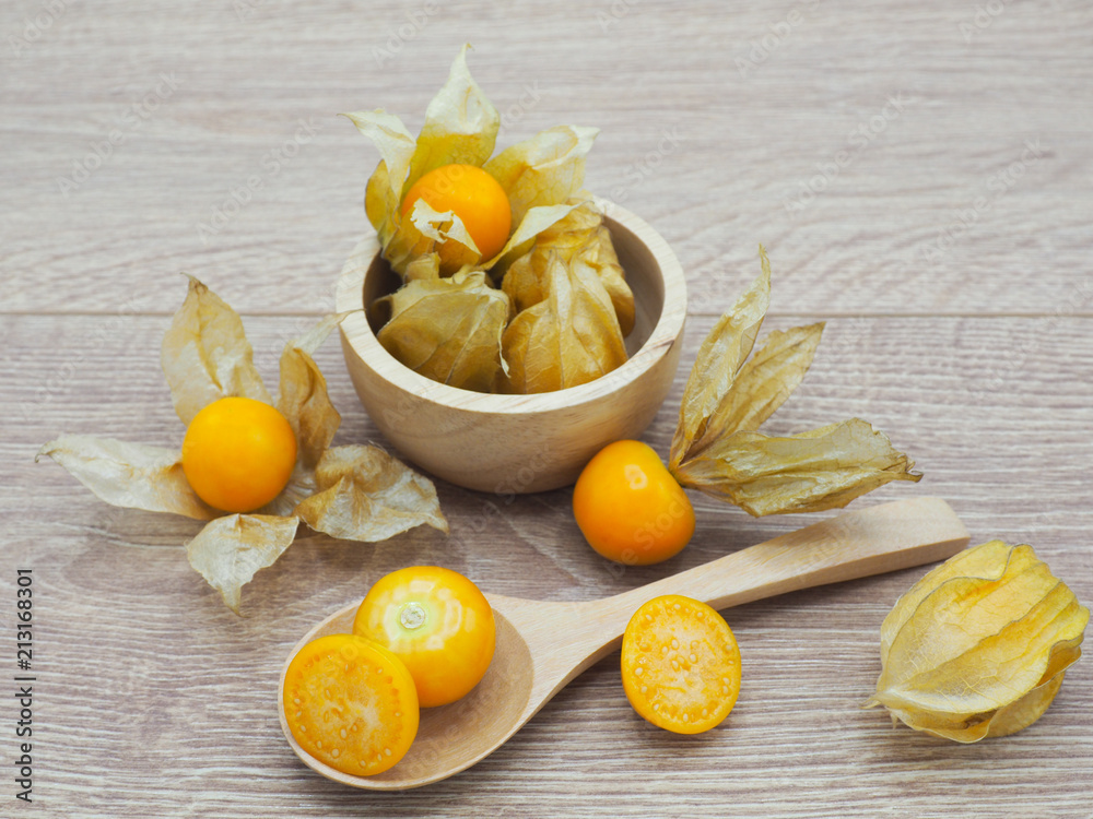 Fresh cape goosebery, physalis, on wooden background Fresh cape goosebery, physalis, on wooden background