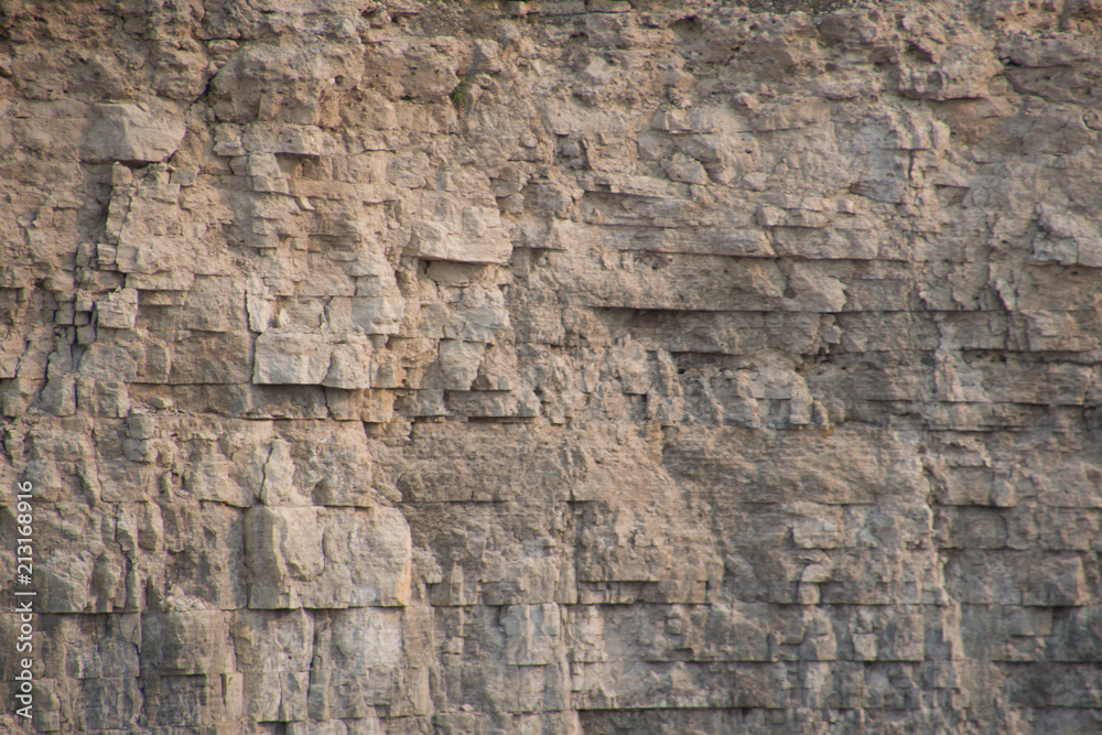 Closeup limestone rock face showing weathered strata Geology walpaper or background - obrazy, fototapety, plakaty 