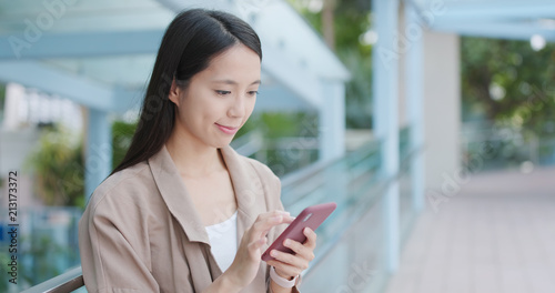Photography Woman working on cellphone at outdoor