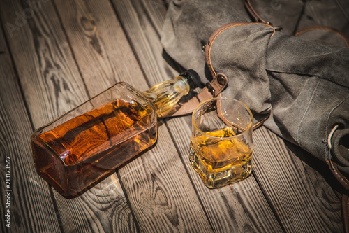 Glass and bottle of bourbon whiskey