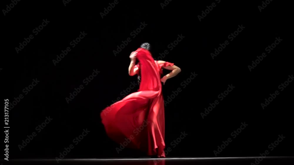 Woman performs elegant movements with her hands in sexual dance. Black background. Slow motion Woman performs elegant movements with her hands in sexual dance. Black background. Slow motion