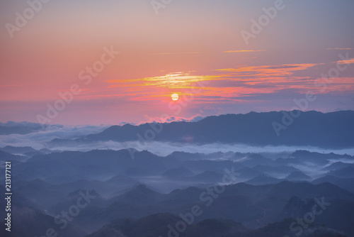 Misty mountain forest background landscape in the morning © Thanabr