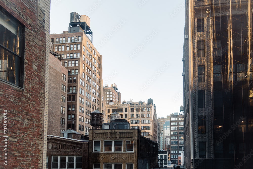 Cityscape of New York with old buildings and water towers