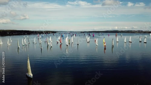 Saliboat in a regatta with low wind condition photo