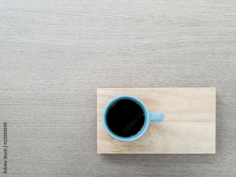 A cup of coffee with wooden tray A cup of coffee with wooden tray