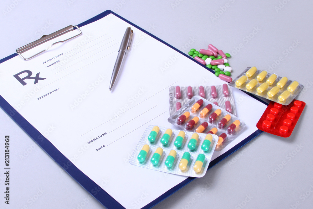 Closeup of a pils, stethoscope, pen on an rx prescription. Closeup of a pils, stethoscope, pen on an rx prescription.