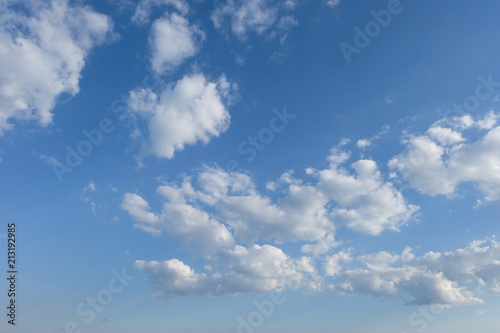 White clouds in summer blue sky photo