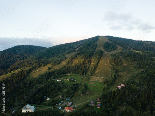 Aerial view to carpathian village Slavske with moutains © bartoshd