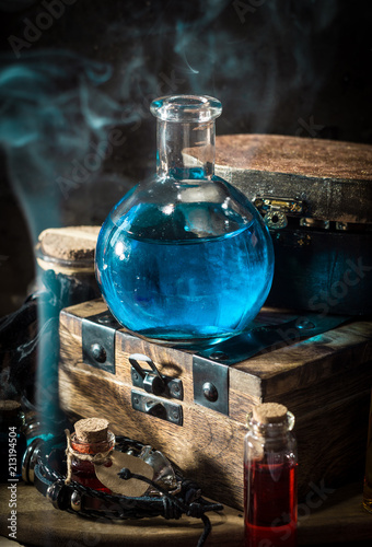 Blue magic potion with smoke