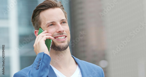 Photography Young businessman talk to cellphone at outdoor