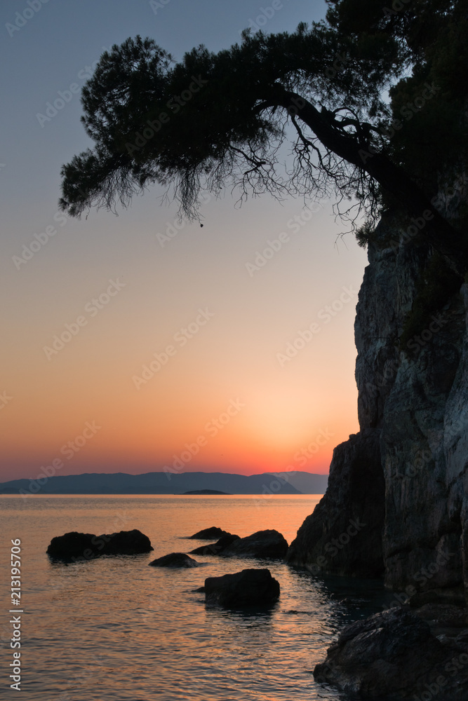 Sihouette of a rocks at sunset, Kastani Mamma Mia beach, island of Skopelos, Greece