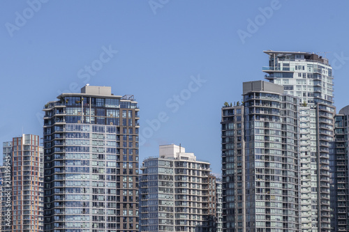 The Top of Several Buildings against a Blue Sky © Hypnotik Photography