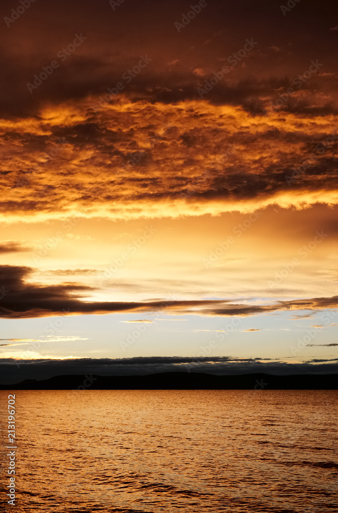 Fototapeta premium sunset over lake - golden color - Balaton, summer, apocalyptic smoke on the sky