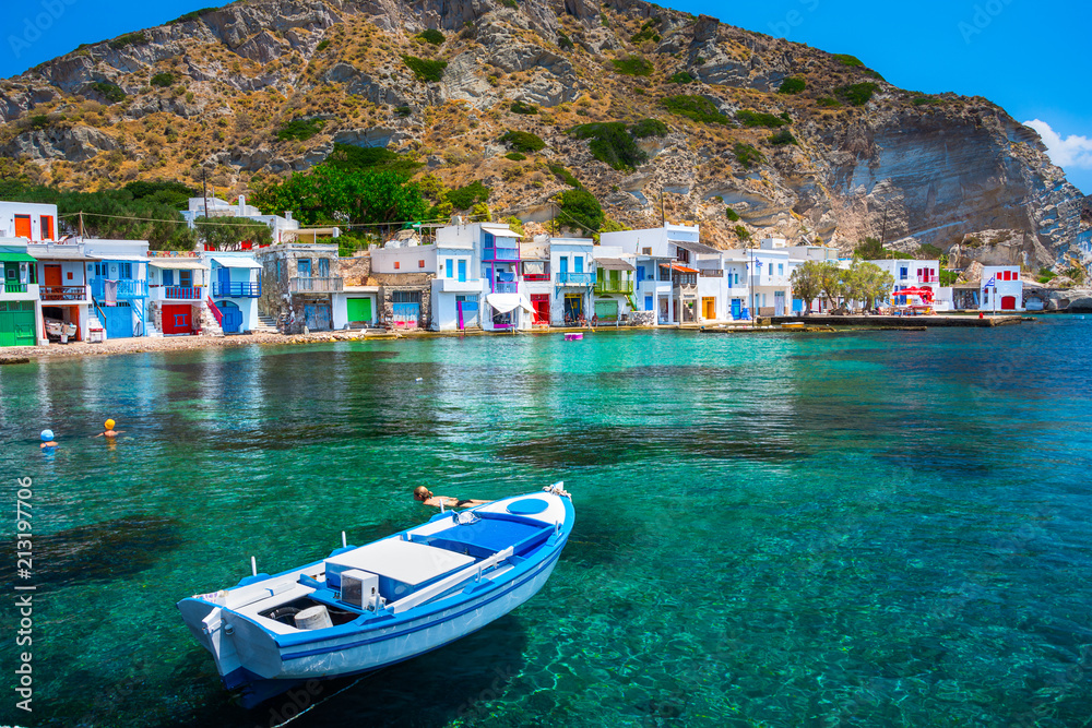 Naklejka premium Scenic Klima village (traditional Greek village by the sea, the Cycladic-style) with sirmata - traditional fishermen's houses, Milos island, Cyclades, Greece.