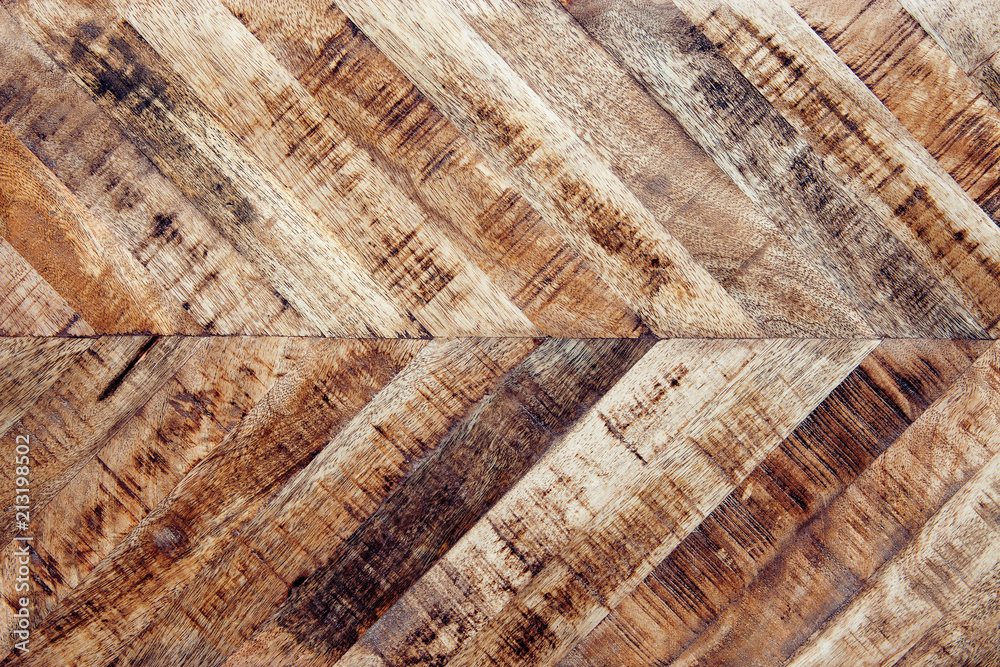 Fototapeta premium Vintage wooden parquet background. Top view of wooden texture. Herringbone, chevron flooring pattern. 