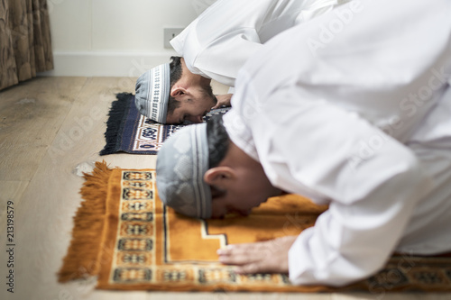 Muslim prayers in Sujud posture photo