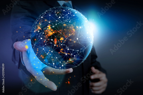 Hand holding Global world telecommunication network connected around planet Earth for internet and worldwide communication technology about finance,Elements of this image furnished by NASA