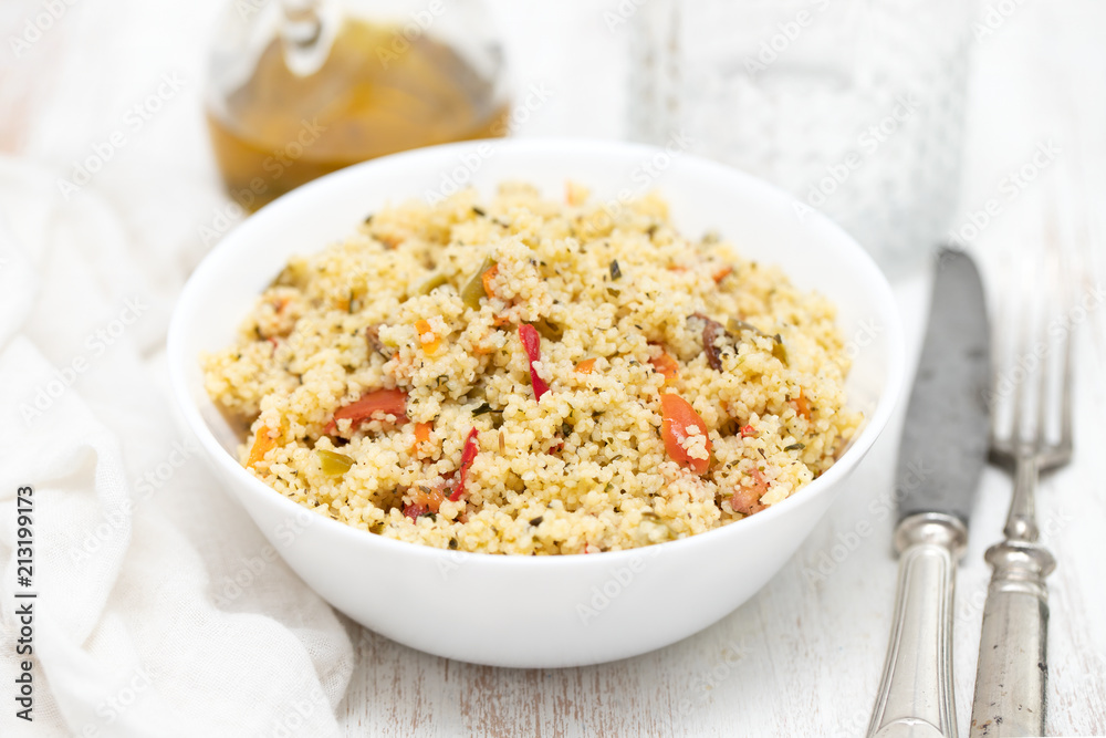 tabbouleh in white bowl on wooden background tabbouleh in white bowl on wooden background