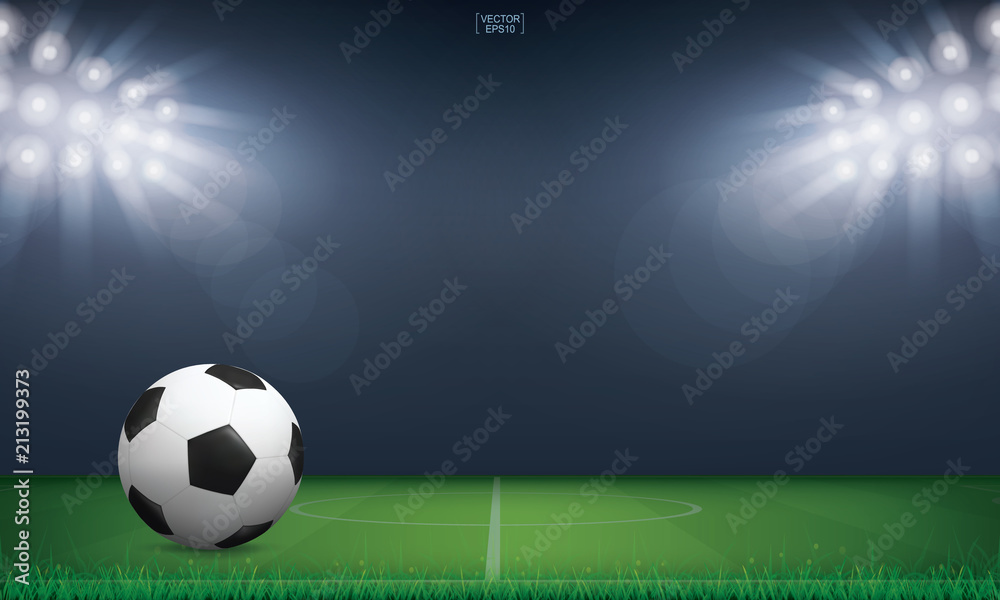 Naklejka premium Soccer football ball on green grass of soccer field or football field stadium background. Vector.