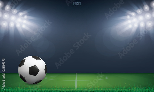 Soccer football ball on green grass of soccer field or football field stadium background. Vector.