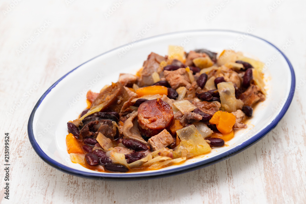 typical portuguese dish feijoada transmontana on white plate typical portuguese dish feijoada transmontana on white plate