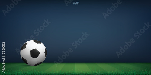 Soccer football ball on green grass of soccer field or football field stadium background. Vector.
