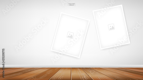 Empty photo frame or picture frame background in room space area with white concrete wall background and wooden floor. Vector.